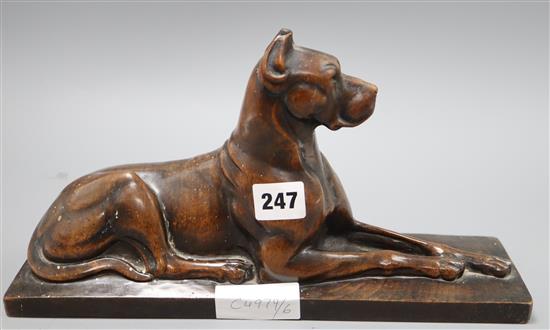 A carved wood figure of a recumbent Great Dane W.32cm